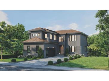 Stunning two-story home with gray siding, stone accents, and a two-car garage at 806 Tyrrell Rd, Raleigh, NC 27609