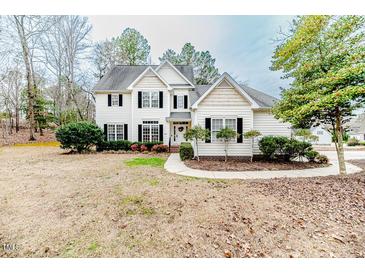 Charming two-story home with a well-maintained lawn and traditional architectural details at 1000 W Landing Dr, Sanford, NC 27330