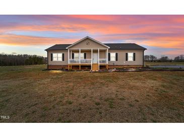 Ranch style home with front porch and landscaped yard at 117 Hinshaw Shop Rd, Liberty, NC 27298