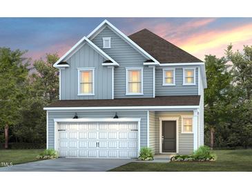 Two-story house with gray siding, white garage door, and landscaping at 2919 Huxley Way, Apex, NC 27502