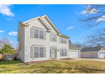 Charming two-story home with classic vinyl siding and attached two-car garage at 2506 Pepperstone Dr, Graham, NC 27253