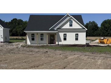 Charming new construction home with classic white siding and a covered front porch at 3963 Baileys Xrds Rd, Benson, NC 27504