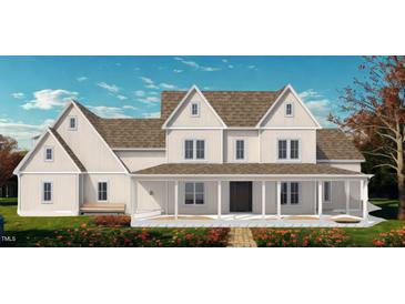 Inviting two-story home boasting a charming covered front porch and craftsman details at 975 Wilbon Rd, Holly Springs, NC 27540