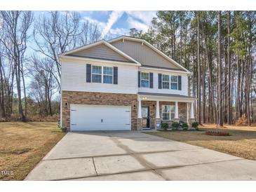 Charming two-story home with a stone-accented facade, attached garage, and a well-manicured front yard at 172 Great Gln, Rocky Mount, NC 27804