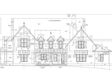 Detailed architectural elevation showcasing the stone veneer, windows, and roofline at 429 Brook Green Ln # 21, Pittsboro, NC 27312