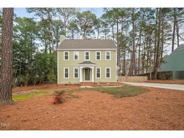 Charming two-story home with a well-maintained yard and classic architectural details at 108 Boxford Rd, Morrisville, NC 27560