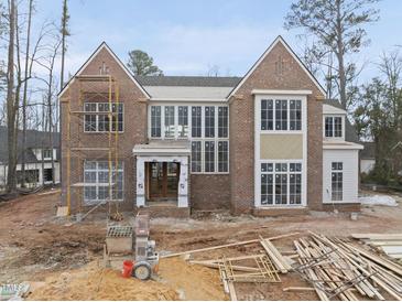 Two-story brick home under construction with large windows and detailed trim work at 436 Oakland Dr, Raleigh, NC 27609