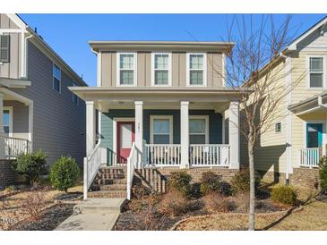 Charming two-story home with inviting front porch and landscaped yard at 781 Fireball Ct, Knightdale, NC 27545