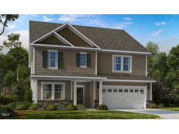 Charming two-story home with attached two-car garage and stone accents at 615 Contento Ct, Sanford, NC 27330