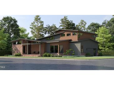 Stunning modern home with a unique roofline, brick accents, and sleek wood and gray siding at 209 Urban Dr, Cary, NC 27511