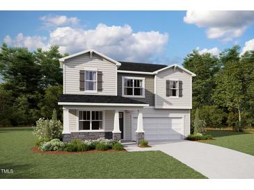 Charming two-story home featuring a two-car garage, well-maintained landscaping, and beautiful architectural details at 456 Barbour Farm Ln, Four Oaks, NC 27524