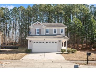 Charming two-story home featuring a spacious two-car garage and a well-maintained front yard at 912 Obsidian Way, Durham, NC 27703