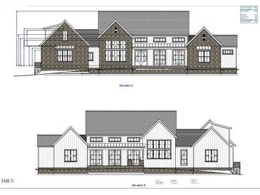 Architectural elevation showcasing the home's front facade with stone and window details at 273 Blufftonwood Dr, Pittsboro, NC 27312