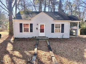 Charming single-story home with a well-kept front yard and classic architectural details at 608 E Ellerbee St, Durham, NC 27704