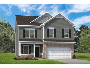 Two-story home with a neutral color scheme and a two-car garage for convenient parking at 106 E Victory View Ter, Smithfield, NC 27577