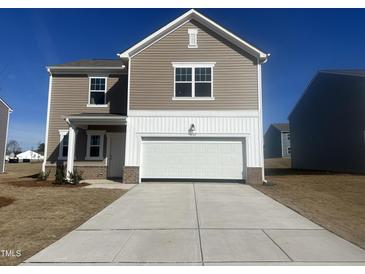 Beautiful new construction home featuring a large garage and neutral siding, ready for personalization at 1137 Centerview Dr, Nashville, NC 27856
