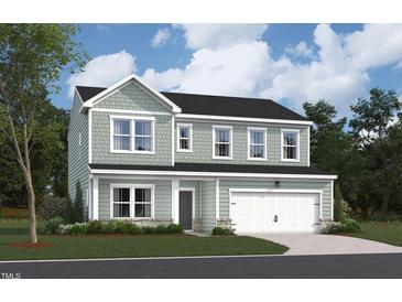 Charming two-story home with neutral siding, black roof, attached two-car garage, and professionally landscaped front yard at 1240 Dimaggio Dr # 35, Raleigh, NC 27616