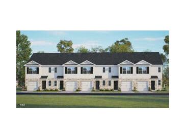 Newly constructed townhomes featuring a blend of modern design with private garages and a sleek black roof at 309 Cherry Laurel Dr, Sanford, NC 27332