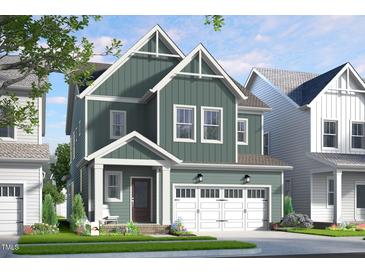 Charming two-story home with an attached two-car garage and well-maintained landscaping at 257 Beacon Dr, Pittsboro, NC 27312