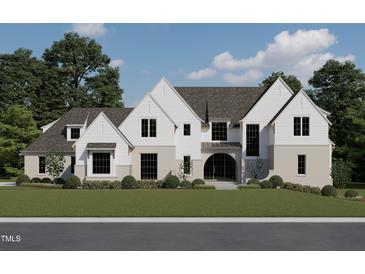 Magnificent new construction home exhibiting light brick and white siding, complemented by lush landscaping and a manicured lawn at 6500 Century Oak Ct, Raleigh, NC 27613
