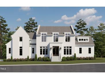Elegant two-story home featuring painted brick, a symmetrical facade, and lush landscaping at 6844 Greystone Dr, Raleigh, NC 27615