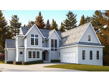 Beautiful two-story home featuring a large, attached garage and well-maintained landscaping at 6903 Bent Pine Pl, Raleigh, NC 27615