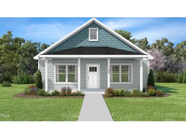 Charming single-story home with blue accents, a well-manicured lawn, and a welcoming front porch at 132 Ambergate Ct, Rocky Mount, NC 27804