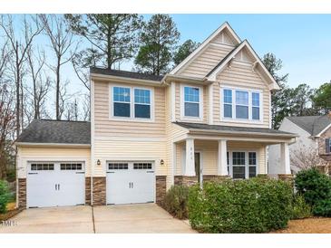 Charming two-story home featuring a two-car garage and inviting front porch, perfect for a Gathering at 211 Court Jester Way, Morrisville, NC 27560