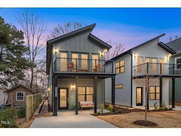 Modern home featuring a covered porch, second story balcony with an updated neutral color palette at 2212 Edwin Ave # B, Durham, NC 27705