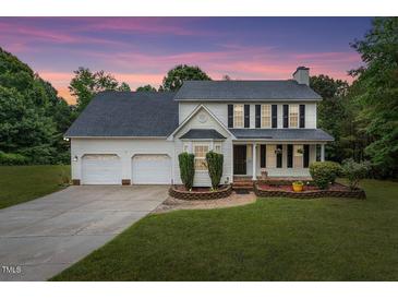 Charming two-story home featuring a three-car garage and a well-manicured lawn at 270 S Ridge Dr, Garner, NC 27529