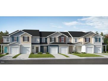 Charming new construction townhomes featuring diverse colors, private garages and inviting curb appeal at 154 Parker Ln, Mebane, NC 27302