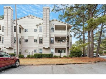 Attractive multi-story condo with a view, set amidst lush landscaping and mature trees at 600 Audubon Lake Dr # 5A32, Durham, NC 27713