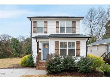 Charming two-story home with a welcoming entrance and well-maintained landscaping at 628 Bragg St, Raleigh, NC 27610
