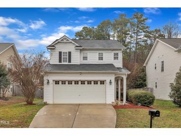 Charming two-story home with a two-car garage and well-manicured landscaping at 181 Steam Engine Way, Garner, NC 27529