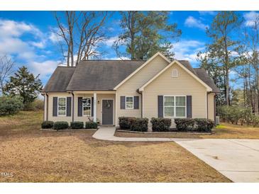 Charming single-story home with a well-manicured lawn and inviting front entrance at 505 Wild Goose Ln, Creedmoor, NC 27522