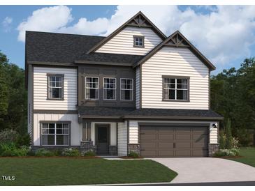 Charming two-story home featuring a modern color scheme and a two-car garage at 1501 Erastus Court Ct # 46, Fuquay Varina, NC 27526