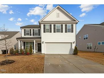 Charming two-story home with black shutters and a two car garage at 456 Highview Dr, Benson, NC 27504