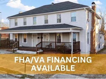 Charming two-story home with a welcoming front porch and FHA/VA financing available at 121 Hamilton St, Henderson, NC 27536