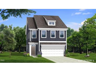 Two-story home with a dark gray facade, complemented by white trim and a covered front entrance at 79 Willow Cameron Way, Angier, NC 27501