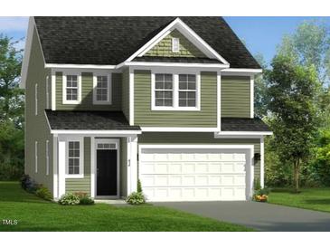 Charming two-story home with green siding, white trim, and attached two-car garage at 89 Willow Cameron Way, Angier, NC 27501