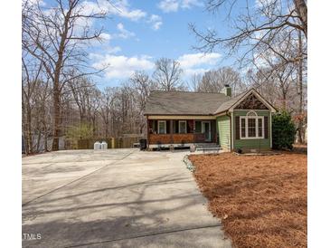 Charming exterior view of a craftsman home with a large concrete driveway at 111 Preakness Dr, Archer Lodge, NC 27527