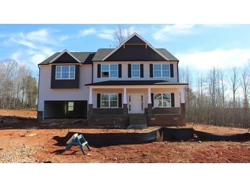 Charming two-story new construction home with covered front porch and an attached two car garage at 1414 Reading Ct # 91Kl, Burlington, NC 27217