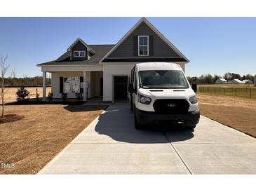 Charming two-story home with a well-maintained front yard and gray/white siding at 45 Trescott St, Smithfield, NC 27577