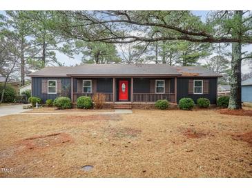 Charming single-story home featuring a welcoming front porch and a vibrant red front door at 1729 Augustus Dr, Rocky Mount, NC 27801