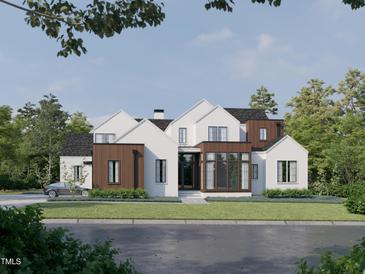 Modern two-story home with a stylish design, large windows, and manicured lawn at 5301 Inglewood Ln, Raleigh, NC 27609