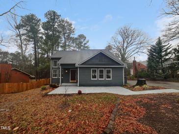 Charming home featuring neutral siding, a well-maintained lawn, and a welcoming concrete entryway at 3300 Mossdale Ave, Durham, NC 27707