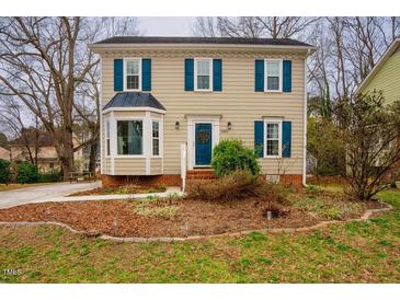 Charming two-story home with a well-manicured front yard and inviting curb appeal at 3320 Derbyshire Pl, Raleigh, NC 27604