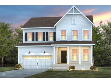 Two-story home with a two car garage, front porch, and manicured lawn at 126 Belmont Stakes Ln, Wendell, NC 27591