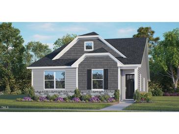 Charming home with gray siding, stone accents, and a well-manicured lawn at 1305 White Verona Way, Knightdale, NC 27545