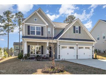 Charming two-story home with a two-car garage and manicured lawn at 192 Kensington Dr, Spring Lake, NC 28390